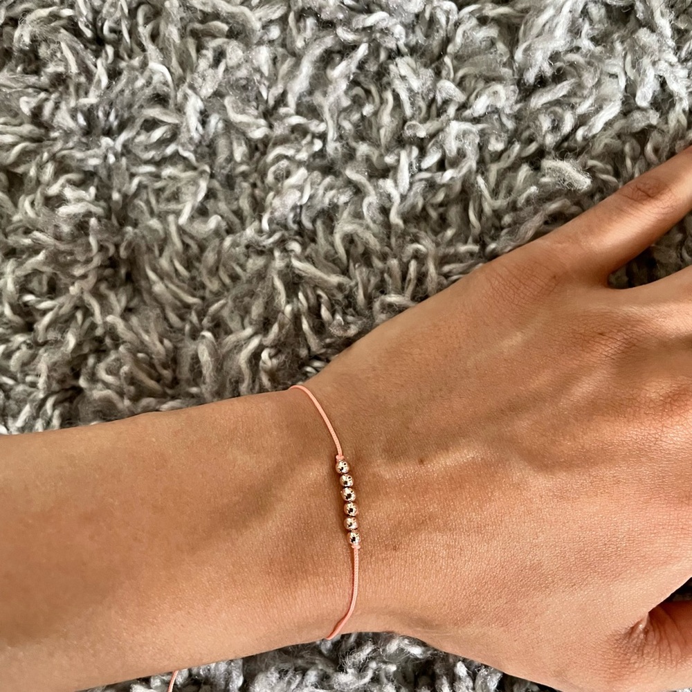 Hand made bracelet with gold beads